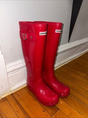 Knee high red rain boots